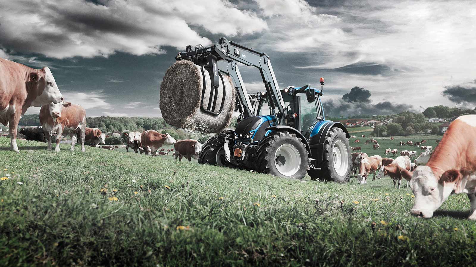 valtra n4 series on the field working with frontloader